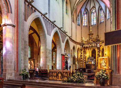 Gniezno Cathedral main nave with symbolic sarcophagus and coffin of St. Adalbert, Sw. Wojciech, martyr in old town Lech Hill historic city center of Gniezno, Poland