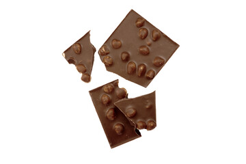 Chocolate bar pieces isolated on white background. Milk chocolate with whole hazelnuts.