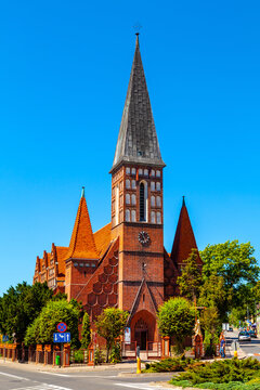 Neo-Gothic St. Andrew Bobola church at Ogrodowa street in historic city center of Szubin in Grater Poland region