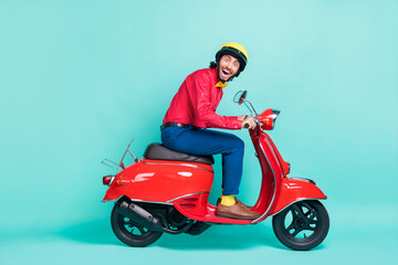 Fototapeta na wymiar Full body profile side photo of funky amazed man ride motorbike isolated on pastel teal color background