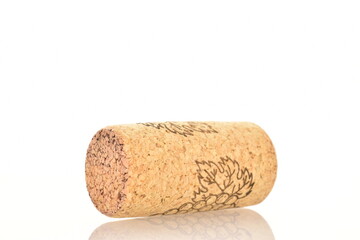 One light brown wine cork, close-up, isolated on white.