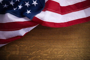 American flag on old wooden board. Celebration frame with free space for text.
