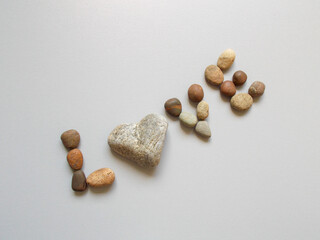 love, pebbles and a heart-shaped stone