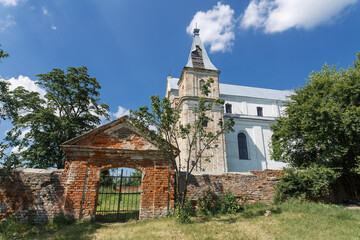 ancient brick Roman Catholic church in Ukraine. exterior of an old brick church.travel to ukraine.  historical monuments of architecture