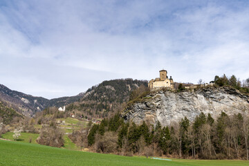 Fototapeta na wymiar mountain landscape in the Swiss Alps with a view of the Ortenstein Castle on a hilltop