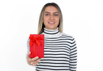 Young woman holding a red gift box. birthday, mothers day valentine's day, gift concept. background, banner.
