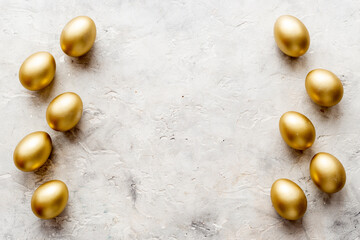 Golden eggs flat lay. Save money. Wealth and good luck symbol