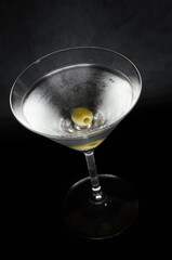 martini cocktail with olive green