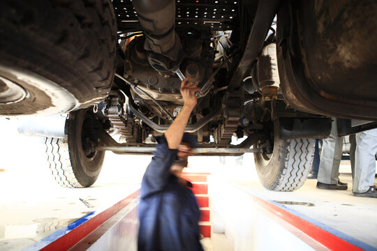 Motor Mechanic Fixing a Truck