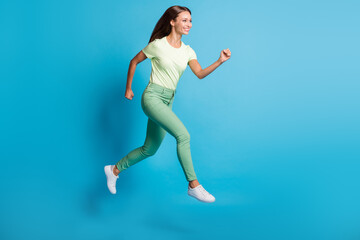 Fototapeta na wymiar Full length body size photo of pretty girl jumping high running fast on sale isolated on bright blue color background