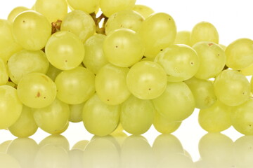 Ripe bunch of grapes, close-up, isolated on black.