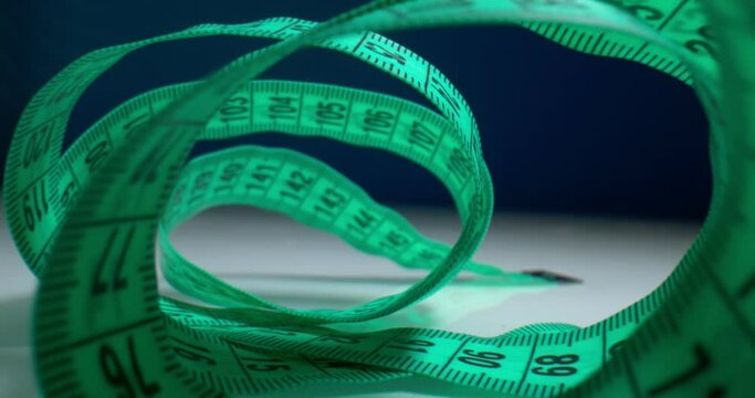 detailed extreme close-up view of the inside of a spiral-wound measuring tape.