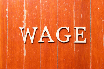 Alphabet letter in word wage on old red color wood plate background