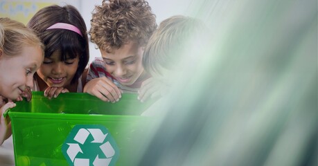 Composition of children looking into green recycling box with screen of smoke