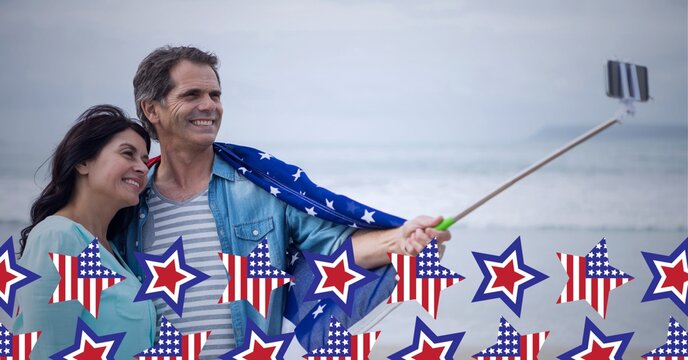 Composition of american flag stars over happy couple taking selfie with smartphone on selfie stick - Powered by Adobe