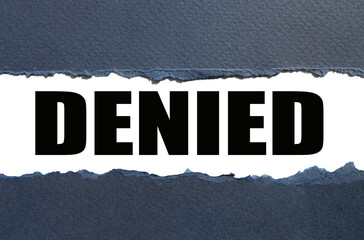 DENIED. the text is written on white paper. text pasted into torn paper.