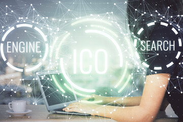 Double exposure of woman hands typing on computer and crypto market theme hologram drawing. Blockchain concept.