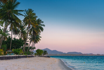 Landscape of paradise tropical island beach, sunset shot.