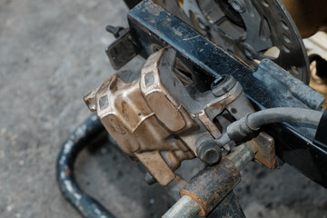 Repair the rear disc brake pump of a motorcycle.