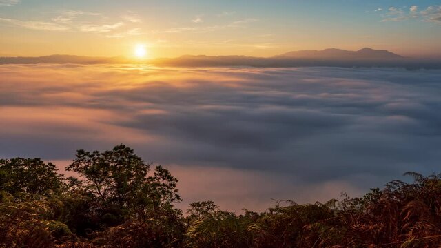 4K Timelapse of beautiful sunrise with fog rolling over mountain in Gunung Silipat viewpoint, Ai yerweng, Yala, Thailand
