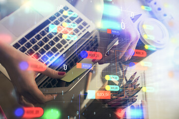 Multi exposure of woman hands working on computer and data theme hologram drawing. Tech concept.