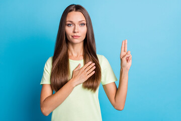 Photo of young attractive woman confident serious hand on chest make promise oath swear isolated...