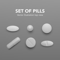 Realistic pills. Set of white drug capsules. Pharmacy medicine and healthcare. Antibiotic or vitamin tablets top view. Vector illustration