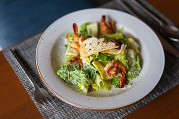 fresh caesar salad in hotel restaurant