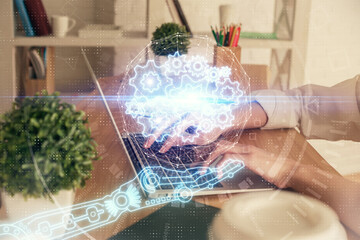 Double exposure of woman hands working on computer and data theme hologram drawing. Tech concept.