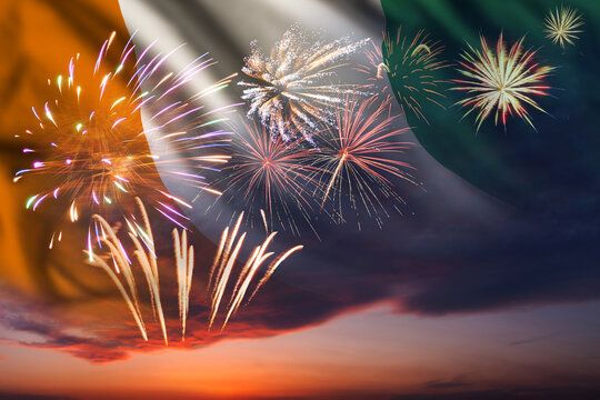 Night sky with fireworks and flag of Cote d'Ivoire