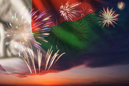 Night sky with fireworks and flag of Madagascar