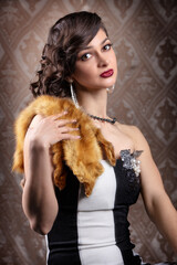 Retro woman portrait. Beautiful girl with red fur in the style of the 20s or 30s. Old fashionable...