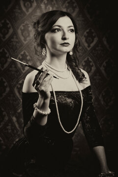 Black and white retro female portrait in the style of 20s or 30s. Photo in vintage style.