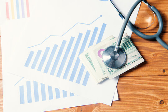 stethoscope on money and statistics