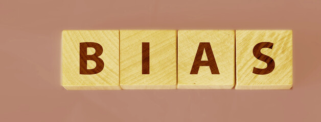 the word bias on wooden blocks blue background