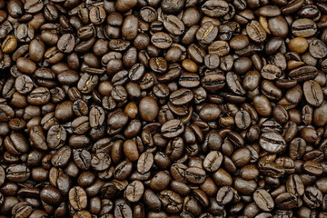 Coffee beans background top view.