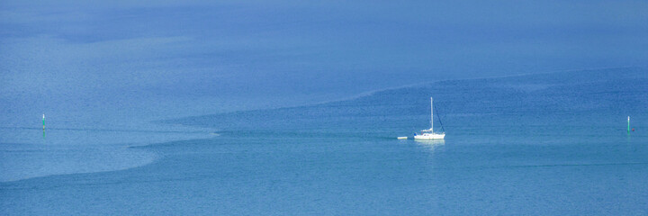 white boat on the blue sea