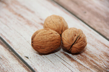 natural walnut fruit in a hard brown shell