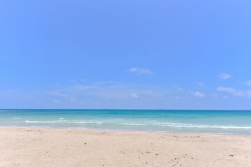 Fototapeta na wymiar Turquoise Sea and Sandy Beach of Thung Wua Laen Beach in Chumphon, Thailand