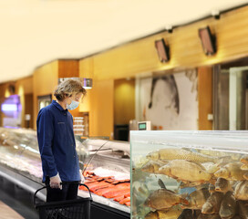 man shopping for fresh fish seafood in supermarket retail store