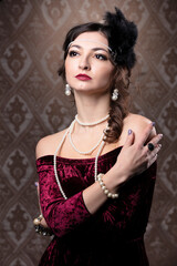 Retro woman portrait. Luxurious lady in vintage style from 20s or 30s.