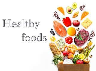Full paper bag with healthy food.Healthy food background.Supermarket food concept. World Food Day.A complete package of healthy products from the supermarket.Shopping at the supermarket.Home delivery.