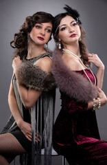 Two women in vintage style, stylized as the era of the 20s or 30s.