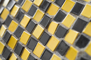 Fototapeta premium Close-up of a mosaic fragment of square ceramic tiles.