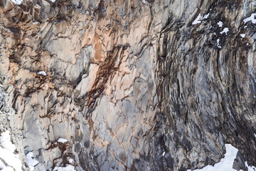 Texture, background. Volcanic rock cliff.