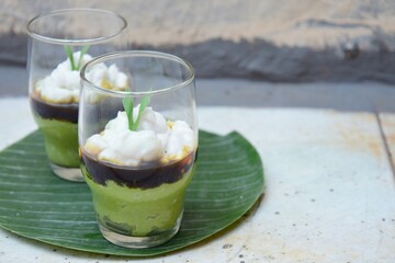Bubur Sumsum Pandan or pandan rice porridge with Palm sugar sauce. Popular food during Ramadan