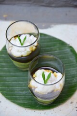 Bubur Sumsum Pandan or pandan rice porridge with Palm sugar sauce. Popular food during Ramadan