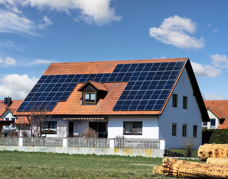 Innovative House with solar collectors- building modified by image editing
