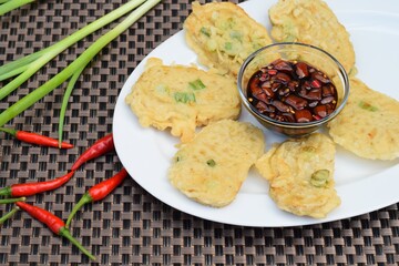 Traditional indonesian food. Tempe Mendoan. Indonesian Street Food, Tempe goreng tepung or fried flour tempe. Served with chilli sweet soy sauce
