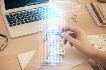 Multi exposure of technology drawing hologram and us dollars bills and man hands. Data concept